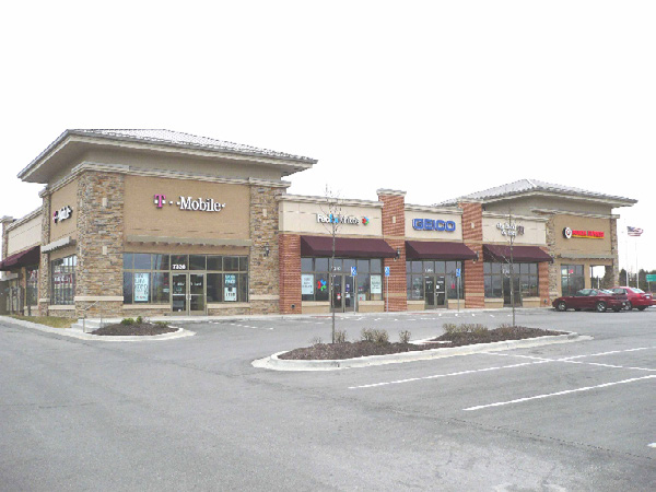 another photo of a commercial building in between either office, retail or parking use structures