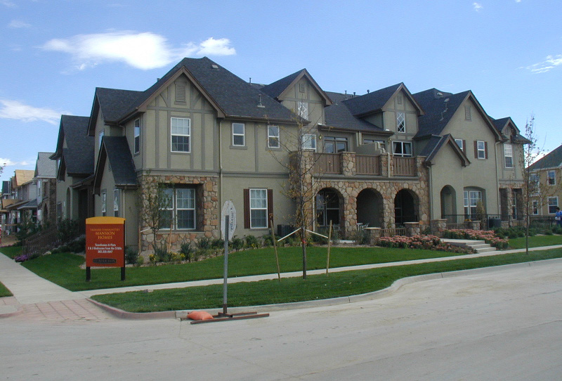photo of an apartment building with lots of details similar to a single-family house