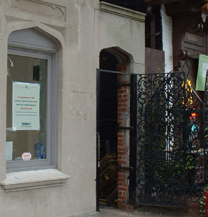 photo of an arched walkway with a gate