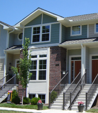 photo of residential building with windows and front doors
