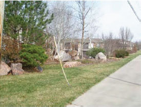 Photo of a Site Perimeter of a Multi-family development from a Single-Family Development
