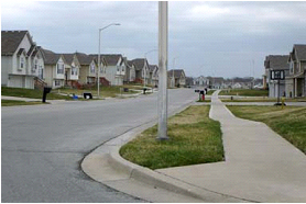 Photo of a landscape plan showing a street with tree lawn with no street trees 