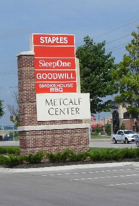 Photo of a Shopping Center signage with multiple store signs