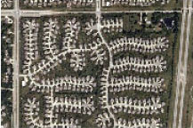 aerial photo of several cul-de-sacs with few street connections  