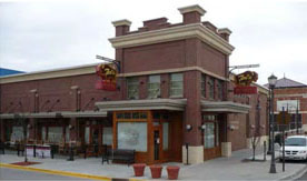 photo of a commercial building with similar detailing on each facade