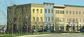 photo of a mixed-use building with different yet compatible detailing on all parts of the building