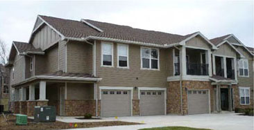photo of residential building with garage doors 