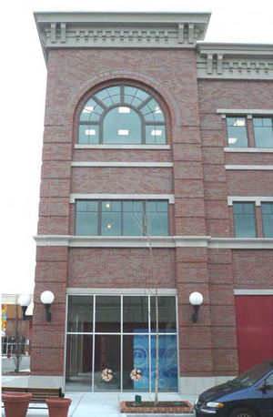 photo of a building with different types of masonry materials with stone lintel and sills