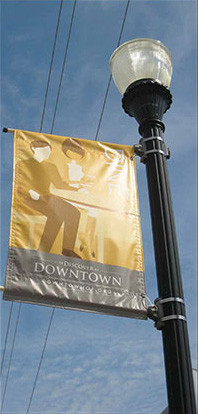 photo of Light post with signage attached 