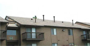 photo of a residential building with a continuous pitched roof