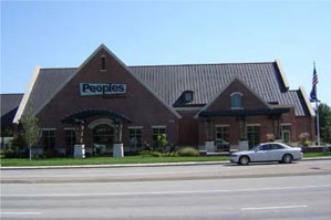 photo of a mixed-use building with a pitched roof 