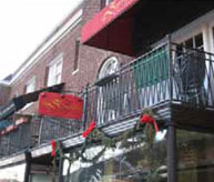 photo of sign above commercial building with balconies