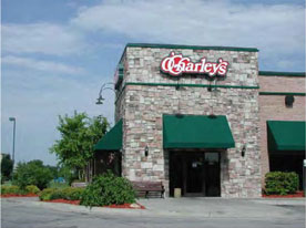 photo of an appropriate sized sign attached to the commercial building structure 