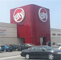 photo of an oversized sign attached to the commercial building structure