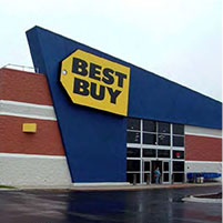 photo of an oversized sign attached to the commercial building structure