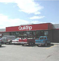 photo of a billboard sign attached to the commercial building structure
