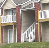 photo of a residential building front entrances with stairs, porches and balconies