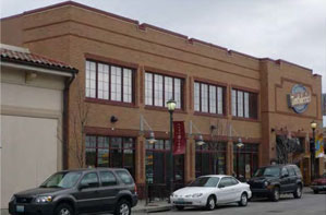 photo of commercial building with second and first story windows in alignment